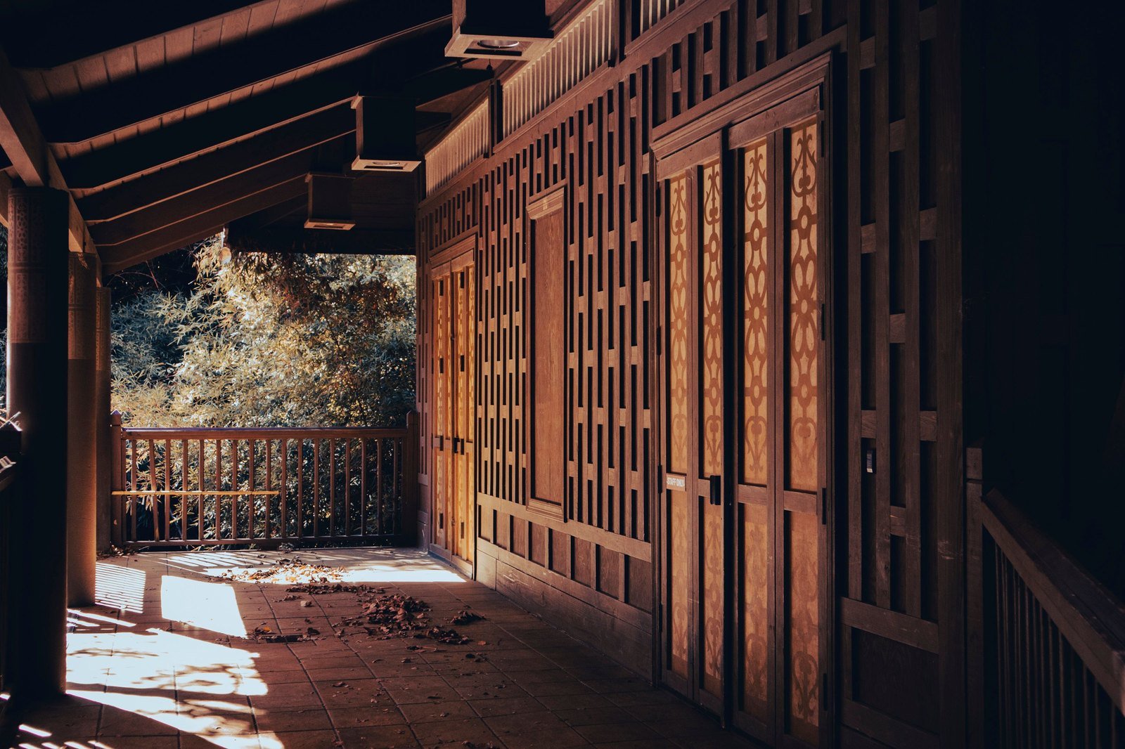Warm sunlight on a classic porch — copper bronze patio screens