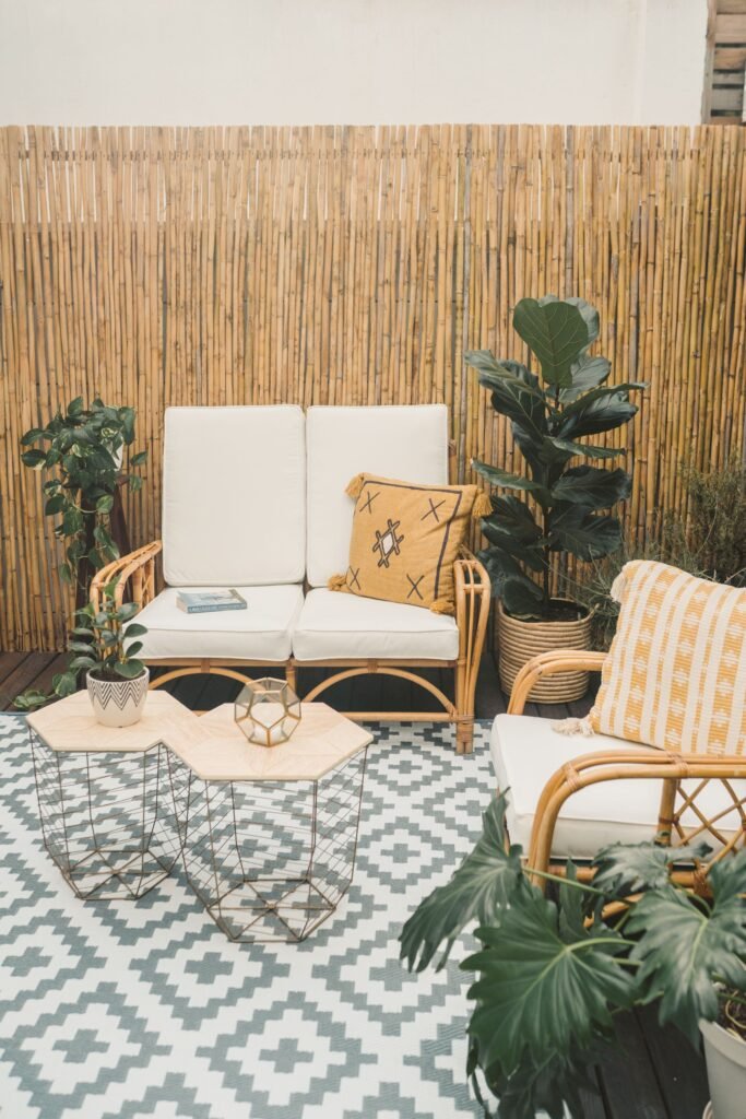 Cozy outdoor living space ideas — layered outdoor rug anchoring a patio seating area