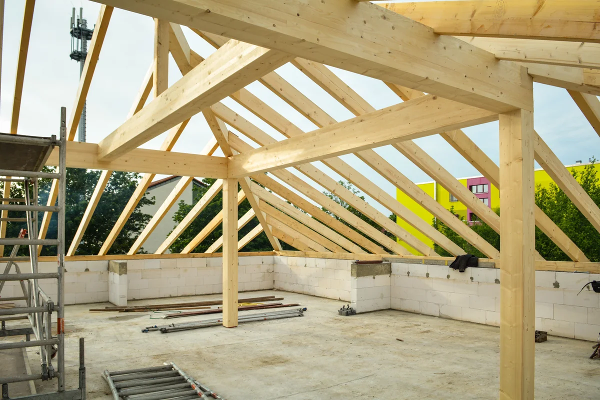 Wooden gable roof rafter framing under construction for DIY patio kit