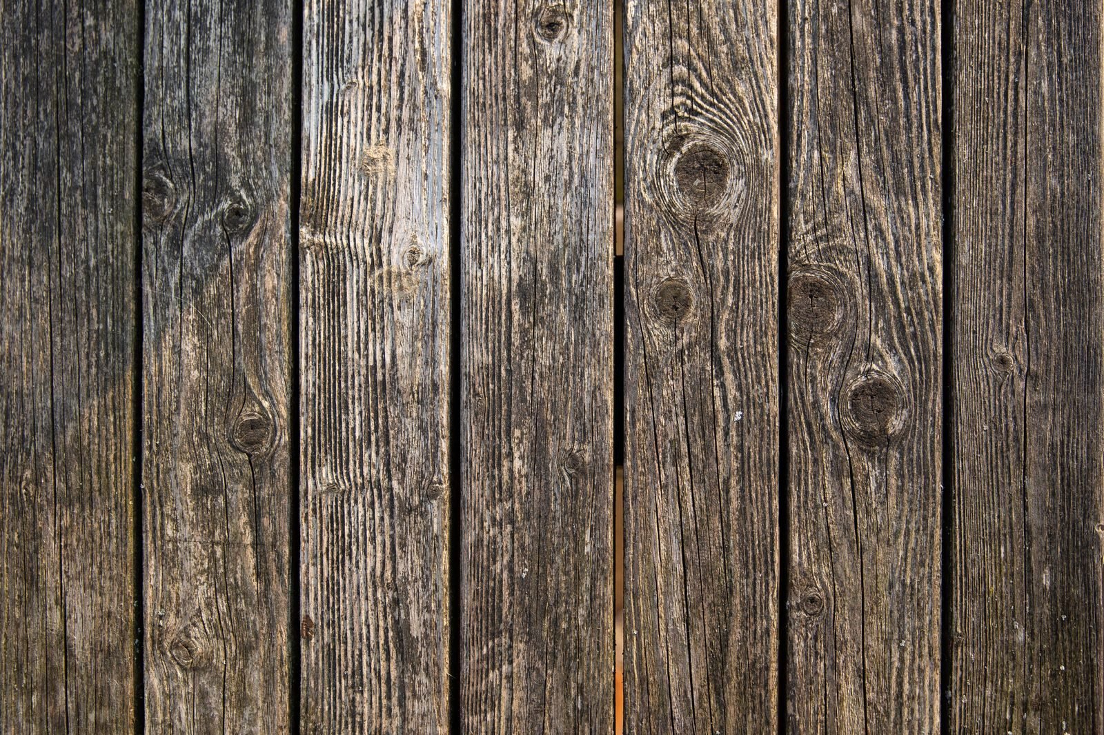 Weathered wooden planks of an outdoor shower enclosure