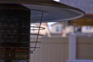 Outdoor patio heater glowing on a patio