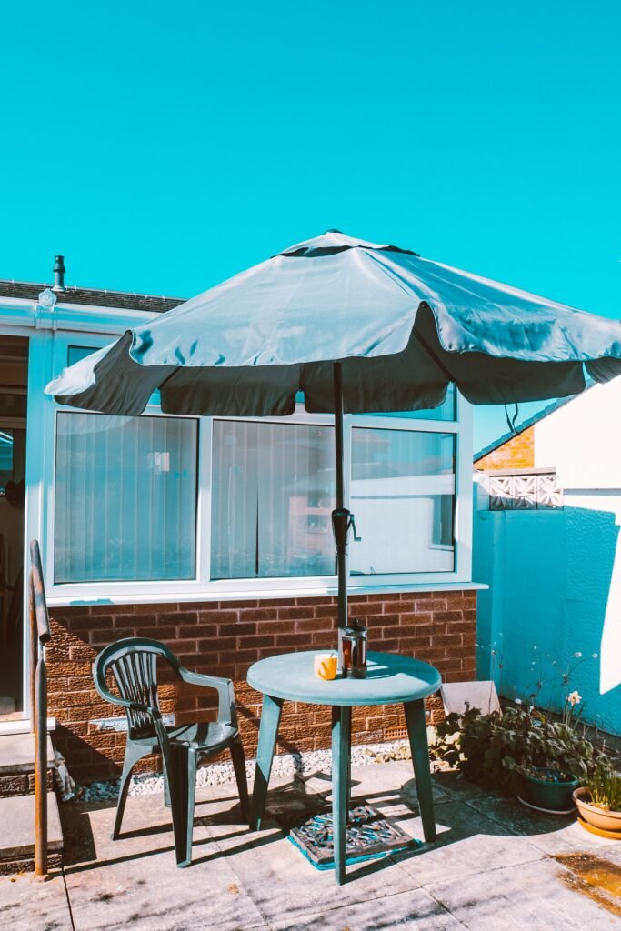 Patio umbrella base weight — umbrella standing on a patio with base
