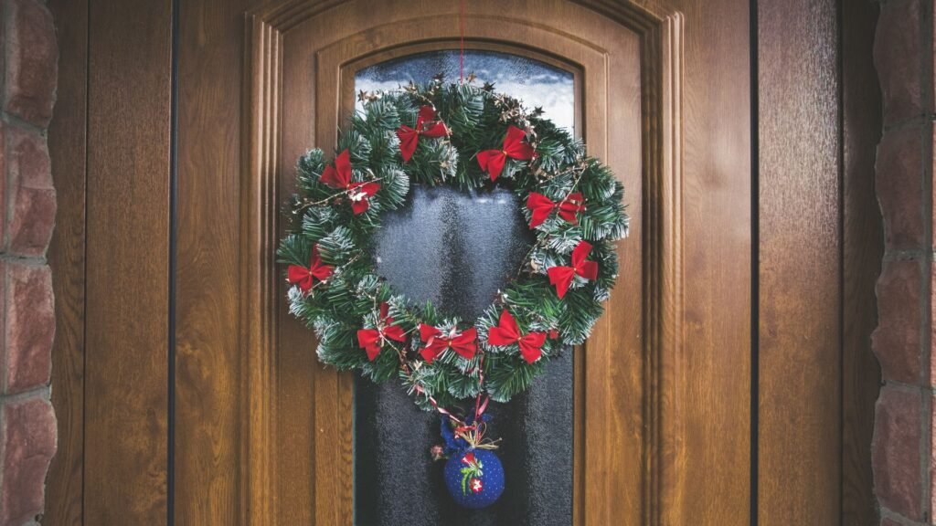 Winter patio decor — evergreen Christmas wreath on a wooden door
